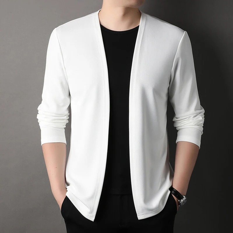 Fine-knit cardigan in chalk, open front, worn over a dark tee