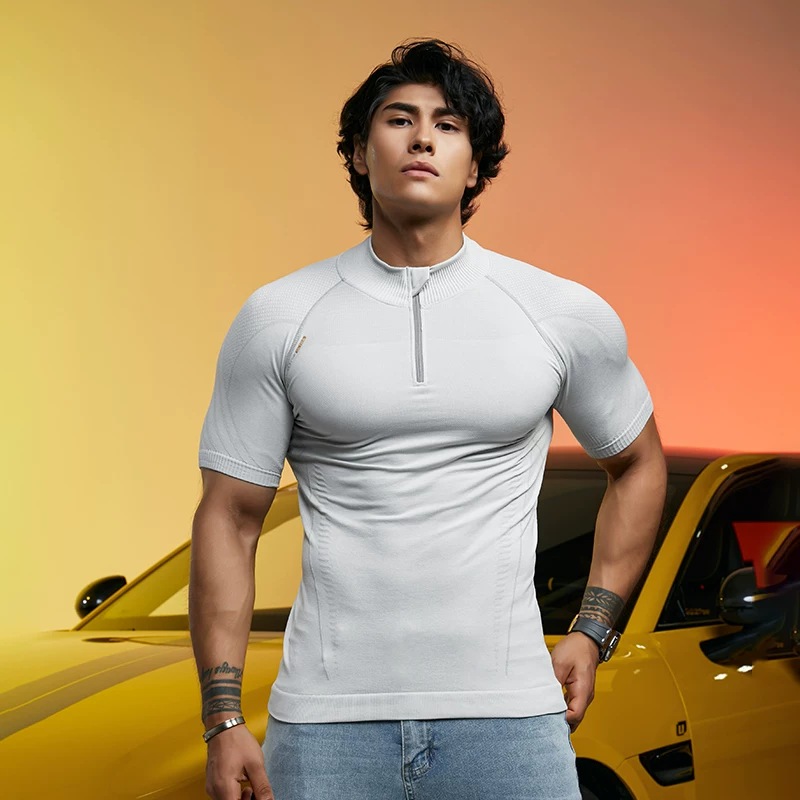 Seamless half-zip tee in silver, worn, quarter zip at the collar